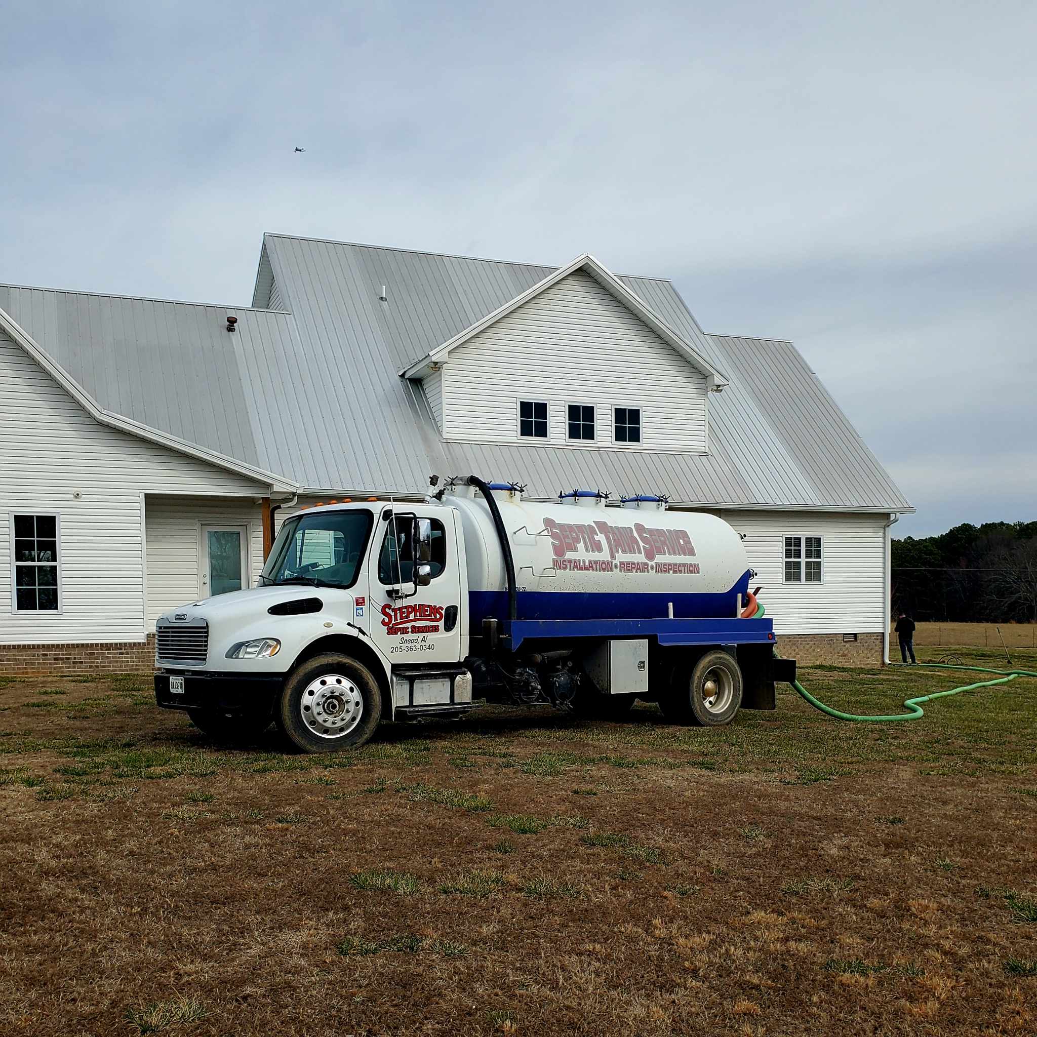 Stephens Septic Service truck on a job site in Marshall County, AL